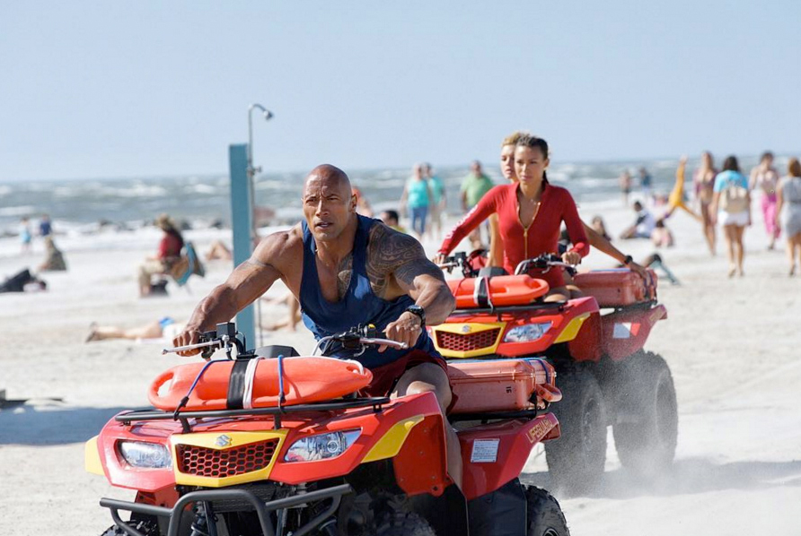Baywatch cast members on a beach during filming