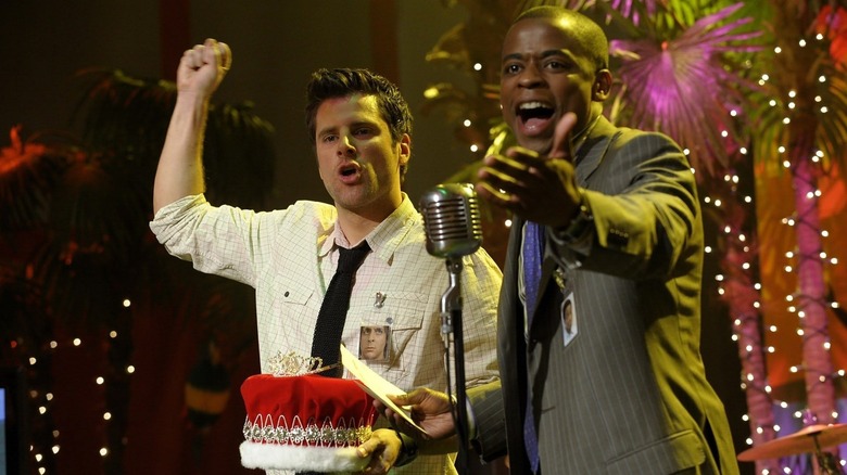 James Roday Rodriguez and Dulé Hill as Shawn and Gus presenting a crown as a high school reunion on Psych