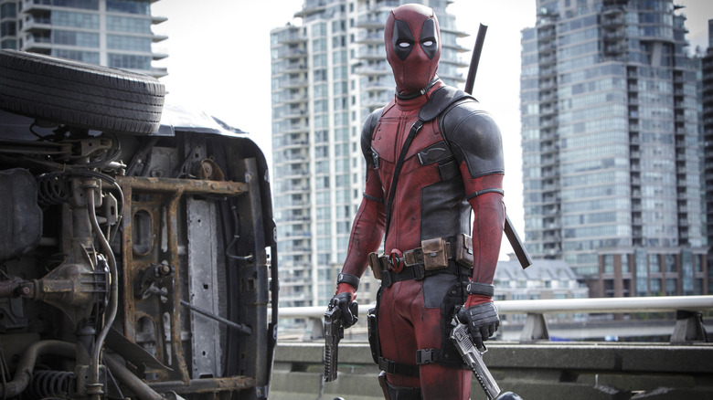 Deadpool holding two guns