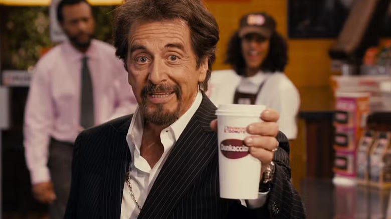 Al Pacino holds up a coffee to the camera in Jack and Jill