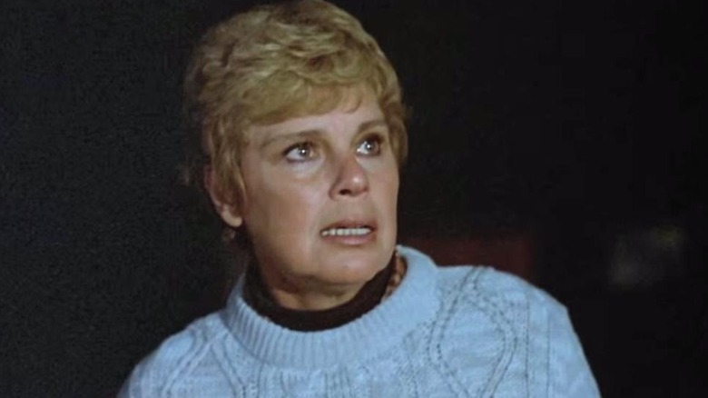 Pamela Voorhees (Betsy Palmer) stands outside in the dark in Friday the 13th (1980)