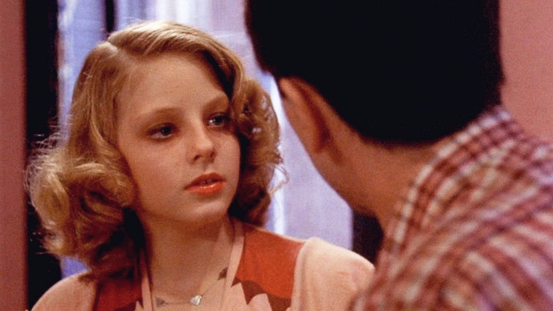 Jodie Foster as Iris Steensma, looking at Travis Bickle in Taxi Driver.