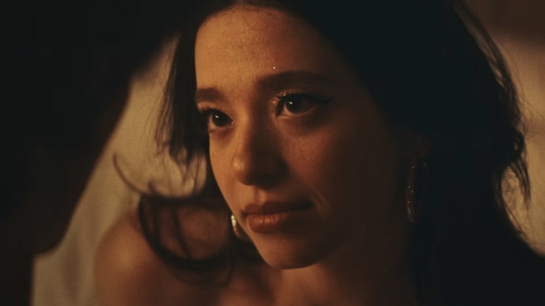Mikey Madison as Anora Mikheeva looks up lovingly in Anora.