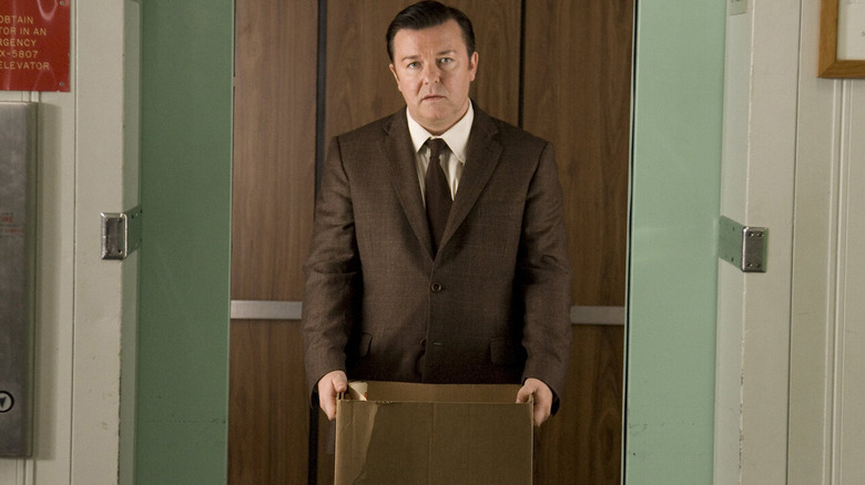 Ricky Gervais as Mark Bellison carrying a box in The Invention of Lying.