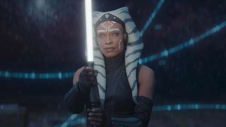 Rosario Dawson as Ahsoka Tano, wielding a lightsaber in Ahsoka.