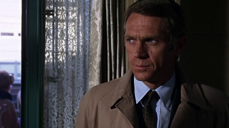 Bullitt (Steve McQueen) looks out the window in Bullitt