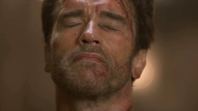 Arnold Schwarzenegger's Jericho Cane closing his eyes in End of Days