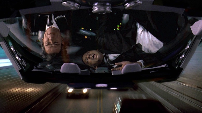Tommy Lee Jones' Agent K and Will Smith's Agent J upside down in a car in Men in Black