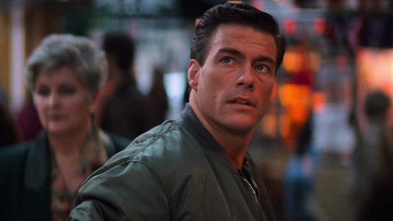 Jean-Claude Van Damme as Max Walker looking up in Timecop