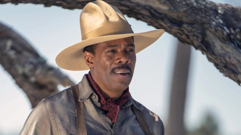 Colman Domingo as Mister Johnson wearing a hat outside near a tree in The Color Purple