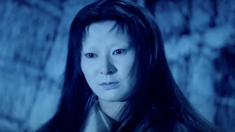 Yuki (Keiko Kishi) stands silently in the snow in Kwaidan