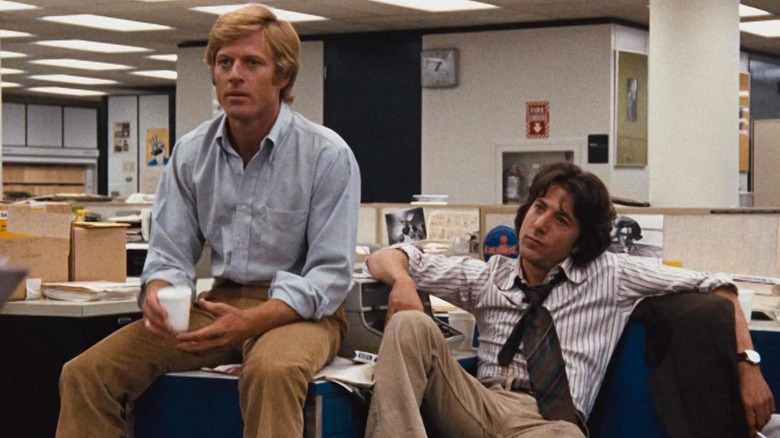 Robert Redford as Bob Woodward and Dustin Hoffman as Carl Bernstein, working at the office in All the President's Men