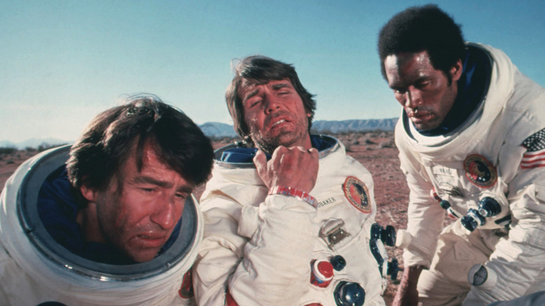 Sam Waterston as Peter and James Brolin as Charles and OJ Simpson as John, realizing they barely escaped with their lives in Capricorn One