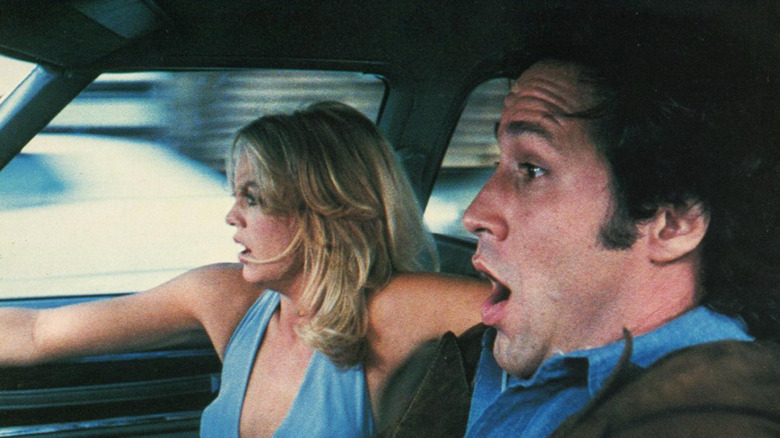 Chevy Chase as Tony and Goldie Hawn as Gloria panic while driving in Foul Play
