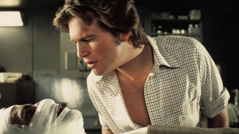 Jeff Bridges as Nick, listening to a dying man in Winter Kills