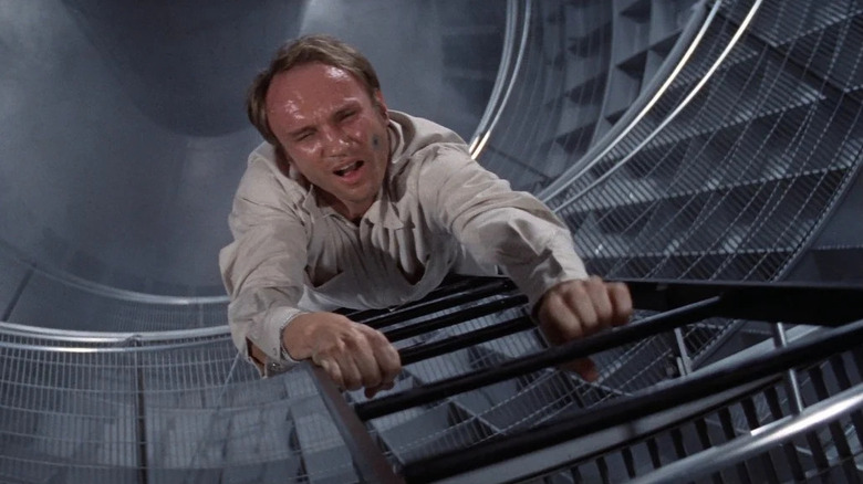 Jerome Stone (Arthur Hill) climbs up the ladder of a smoking nuclear silo in The Andromeda Strain