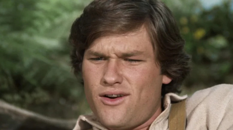 Buck Henry Woolfe (Kurt Russell) reacts with surprise in Gunsmoke