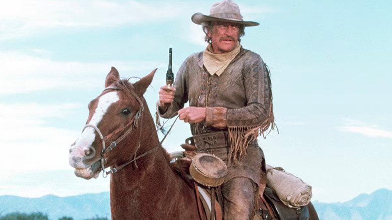 Zeb Macahan (James Arness) holds a gun on horseback in How the West Was Won (1976-1979)