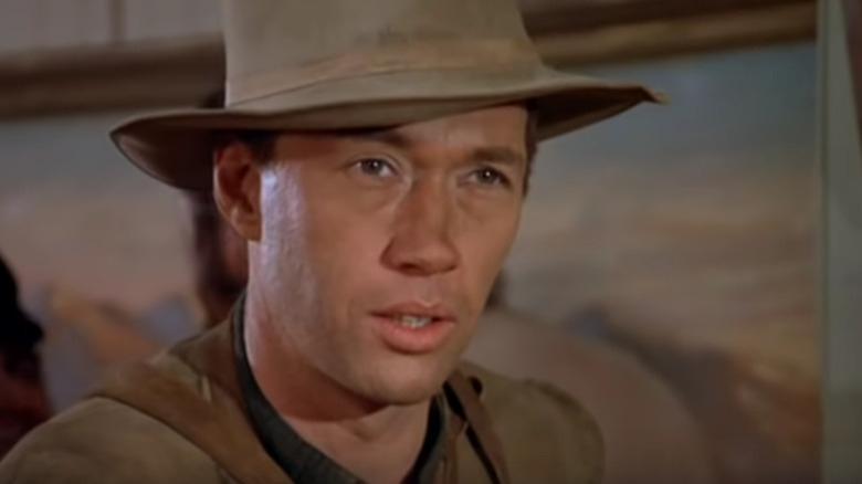 Kwai Chang Caine (David Carradine) sits in a saloon in Kung Fu (1972)