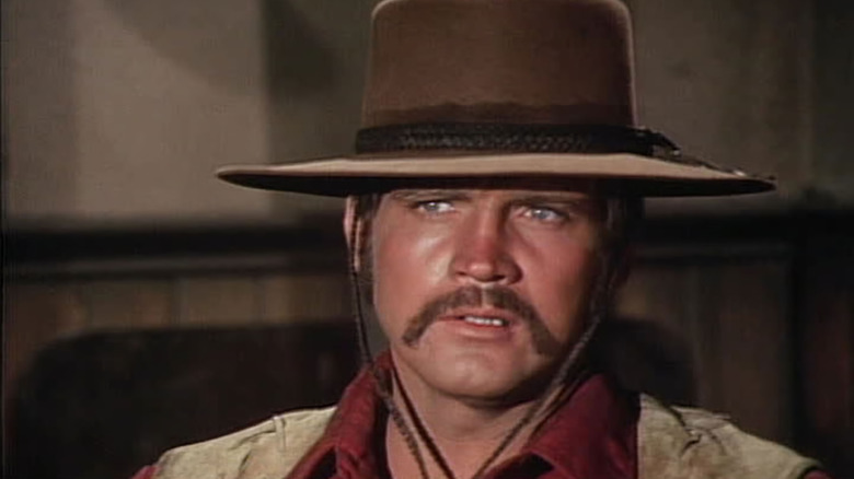 Roy Tate (Lee Majors) glances warily in The Men from Shiloh
