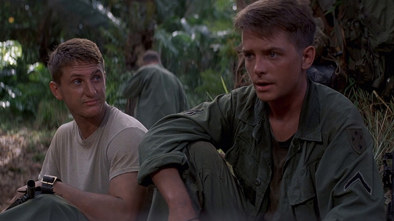 Sean Penn as Meserve and Michael J Fox as Eriksson, in a rare moment of calm in Casualties of War