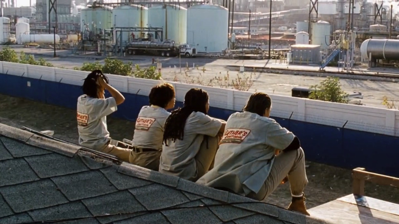 Jada Pinkett Smith as Stony, Queen Latifah as Cleo, Vivica A. Fox as Frankie, and Kimberly Elise as T.T., seen from behind sitting on a roof in their sanitation work uniforms.