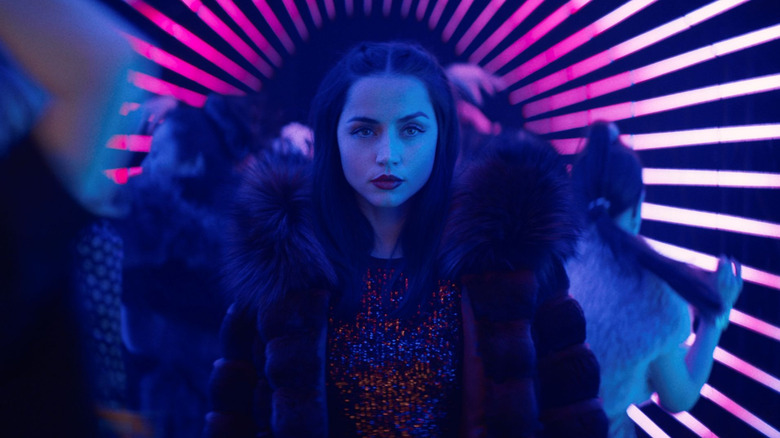 Ana de Armas as Eve Macarro walking in a club in Ballerina