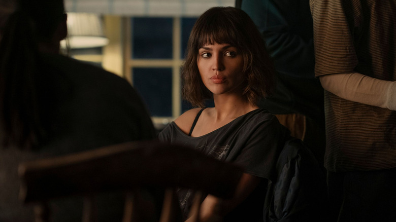 Eiza González as Auggie Salazar sitting and staring in 3 Body Problem