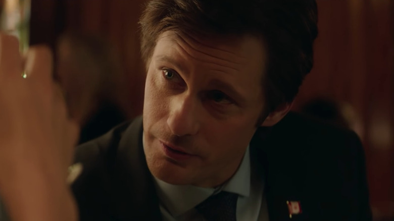 Alexander Skarsgård as the Canadian Prime Minister, smiling at a bar in Long Shot