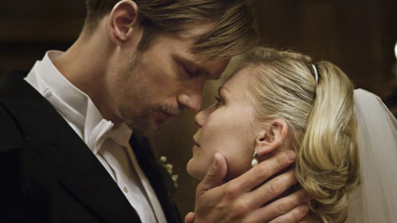Alexander Skarsgård and Kirsten Dunst as Michael and Justine, kissing on their wedding night in Melancholia