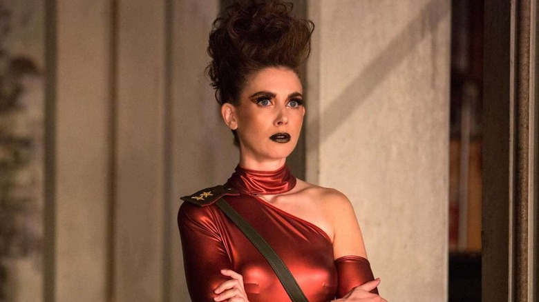 Alison Brie as Ruth, in costume waiting off stage in Glow