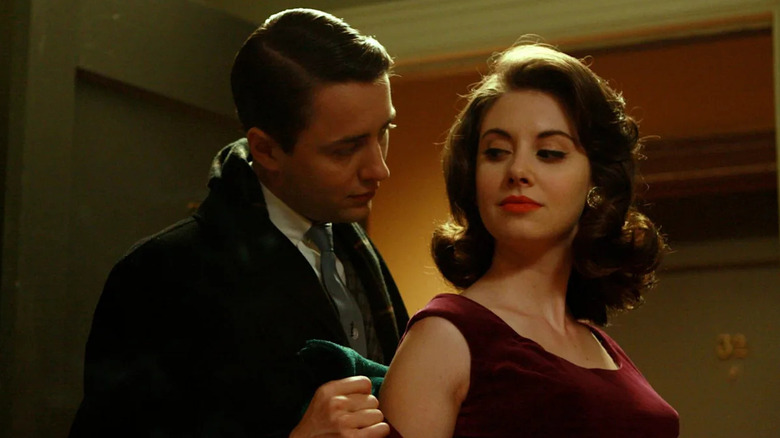 Vincent Kartheiser and Alison Brie as Pete and Trudy, looking into each other's eyes on Mad Men