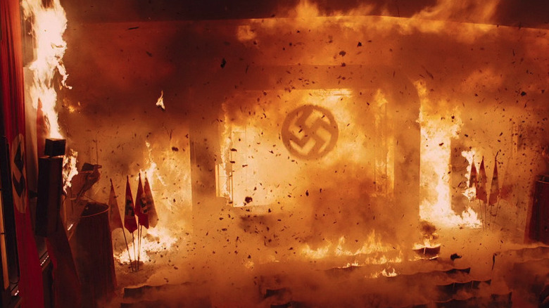 Fire burns Nazi flags and banners in a movie theater in Inglourious Basterds