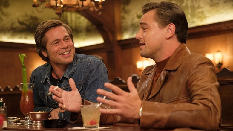 Brad Pitt as Cliff and Leonardo DiCaprio as Rick, hanging out at a bar in Once Upon a Time in Hollywood