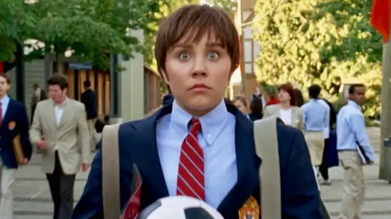 Amanda Bynes as Viola disguised as Sebastian holding a soccer ball in She's the Man