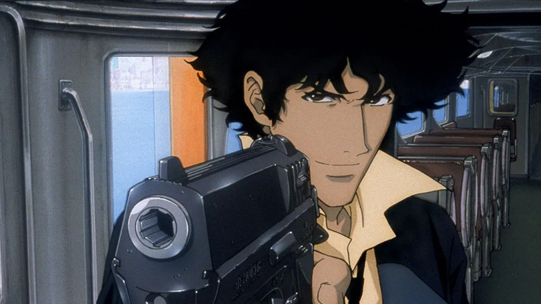 Spike Spiegel points a gun on a train in Cowboy Bebop