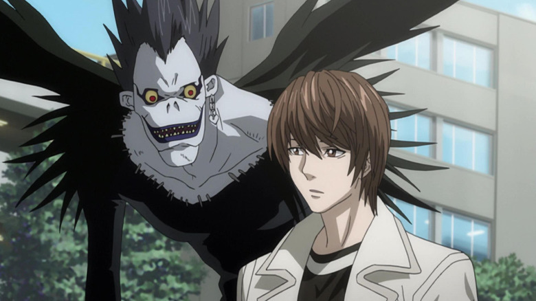 Ryuk walks alongside Light Yagami in Death Note
