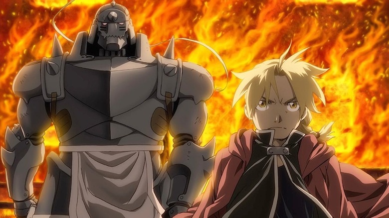 Alphonse and Edward Elric marching through fire in Fullmetal Alchemist: Brotherhood