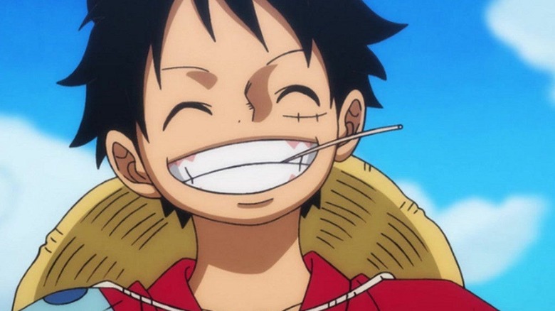 Monkey D Luffy smiles with straw in his mouth on One Piece