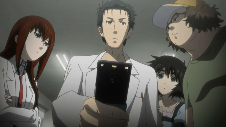 The young scientists look at a phone in Steins;Gate