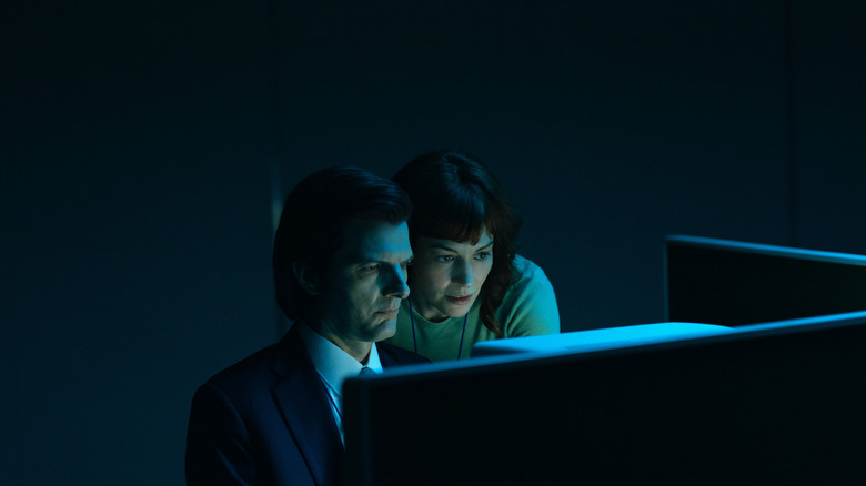Helly and Mark looking at his macrodata refinement computer on Severance