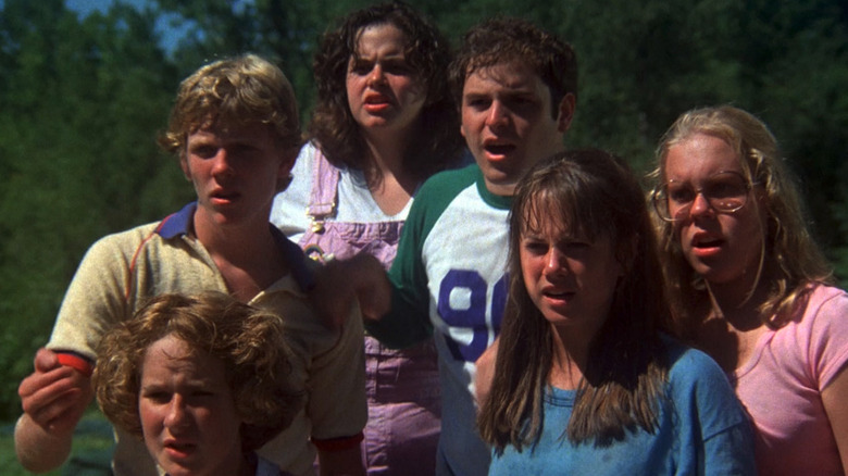 The ensemble cast of The Burning (1981) looks horrified at something off-screen