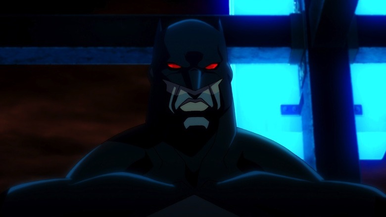 Kevin McKidd as Thomas Wayne / Batman in Justice League: The Flashpoint Paradox, grimacing while looking on with blood red eyes in his Batsuit.