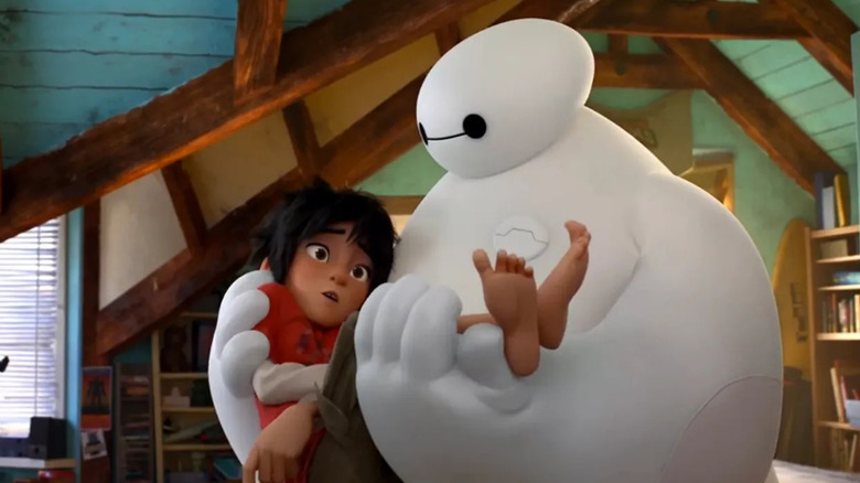 Baymax (Scott Adsit) hugs Hiro (Ryan Potter) in Big Hero 6