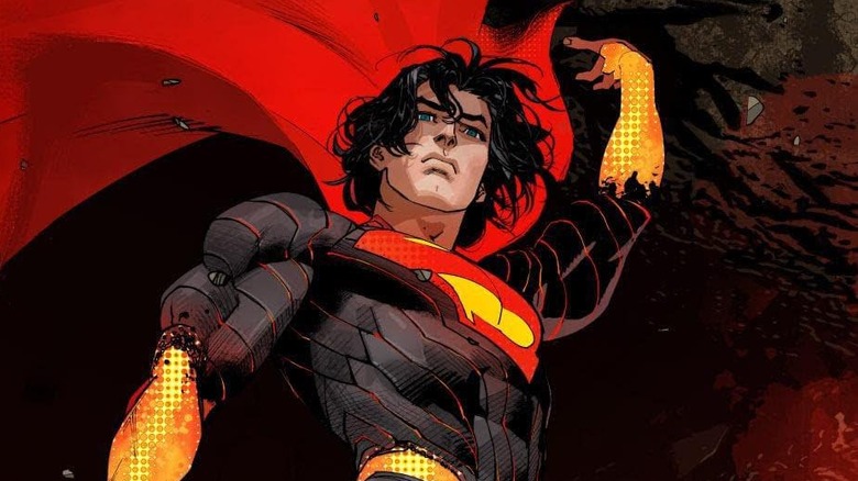 Absolute Superman flies, holding a rock over his head