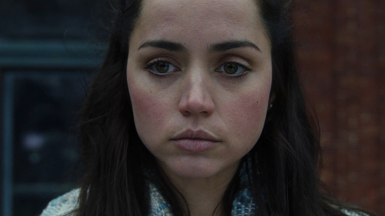 Ana De Armas as Marta Cabrera, looking over her balcony in Knives Out