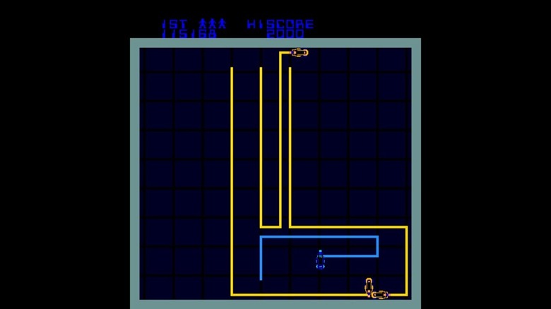 A yellow Light Cycle creates a perimeter around a blue Light Cycle in Tron (1982)