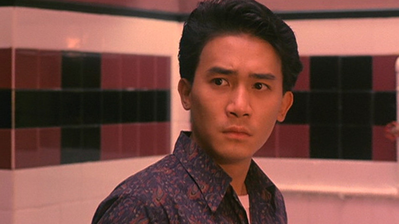 Ben (Tony Leung) stands in a bathroom in Bullet in the Head