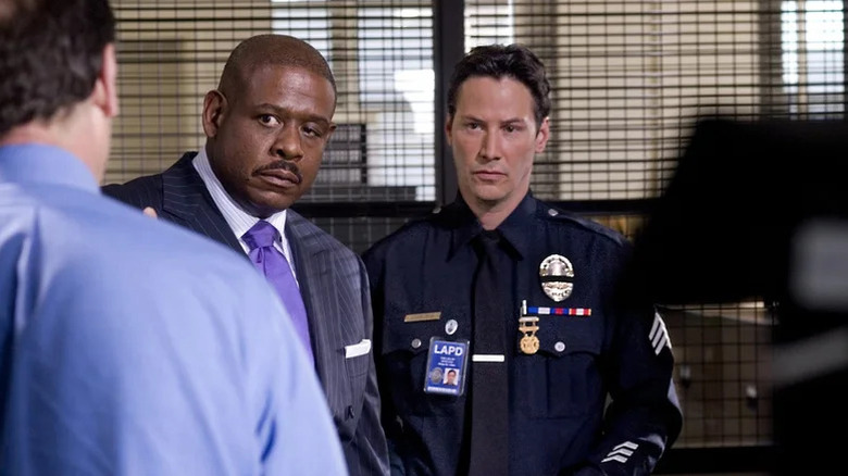 Jack Wander (Forest Whitaker) and Tom Ludlow (Keanu Reeves) eye a detective in Street Kings