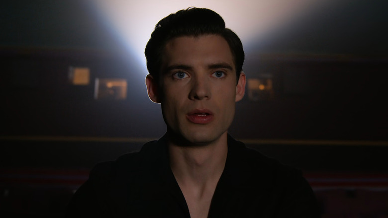 Jack (David Corenswet) staring at screen in theater in Hollywood